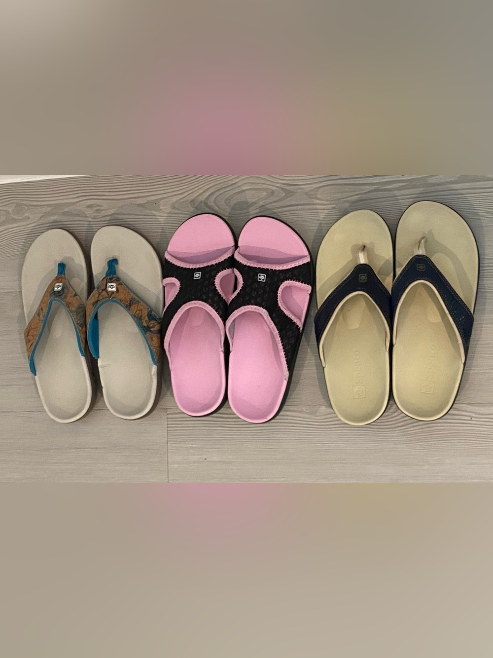 Three pairs of Spenco brand sandals, Yumi flip-flop type